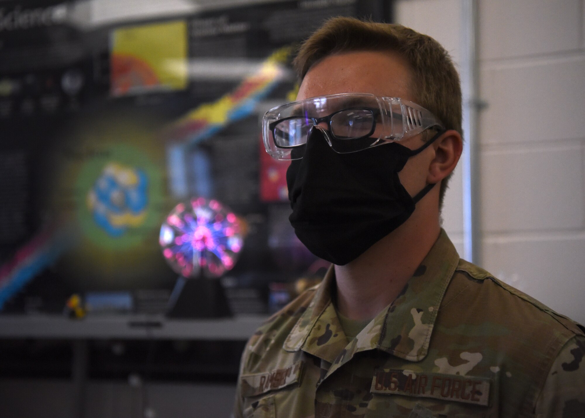 U.S. Air Force Airman 1st Class Hunter Ramsey, 312th Training Squadron Special Instruments Training course student, wears personal protective equipment during the plasma chamber’s vacuum demonstration, inside the Louis F. Garland Department of Defense Fire Academy on Goodfellow Air Force Base, Texas, Aug. 5, 2020. The SPINSTRA course was 85 training days and taught electronic principles, applied sciences, computer and network fundamentals, phenomenology, and  Intelligence, Surveillance, and Reconnaissance fundamentals. (U.S. Air Force photo by Airman 1st Class Abbey Rieves)