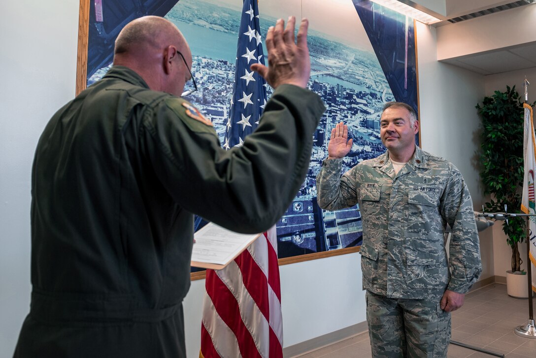 Man reciting oath of office.