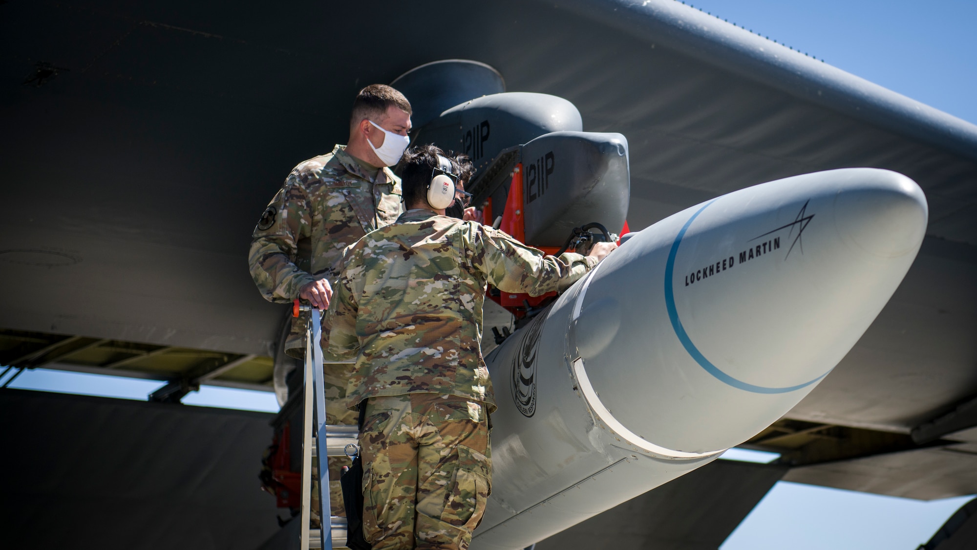 Master Sgt. John Malloy and Staff Sgt. Jacob Puente, both from 912th Aircraft Maintenance Squadron, secure the AGM-183A Air-launched Rapid Response Weapon Instrumented Measurement Vehicle 2 as it is loaded under the wing of a B-52H Stratofortress at Edwards Air Force Base, California, Aug. 6. The ARRW IMV-2 successfully completed a captive carry test off the Southern California coast, Aug. 8. (Air Force photo by Giancarlo Casem)
