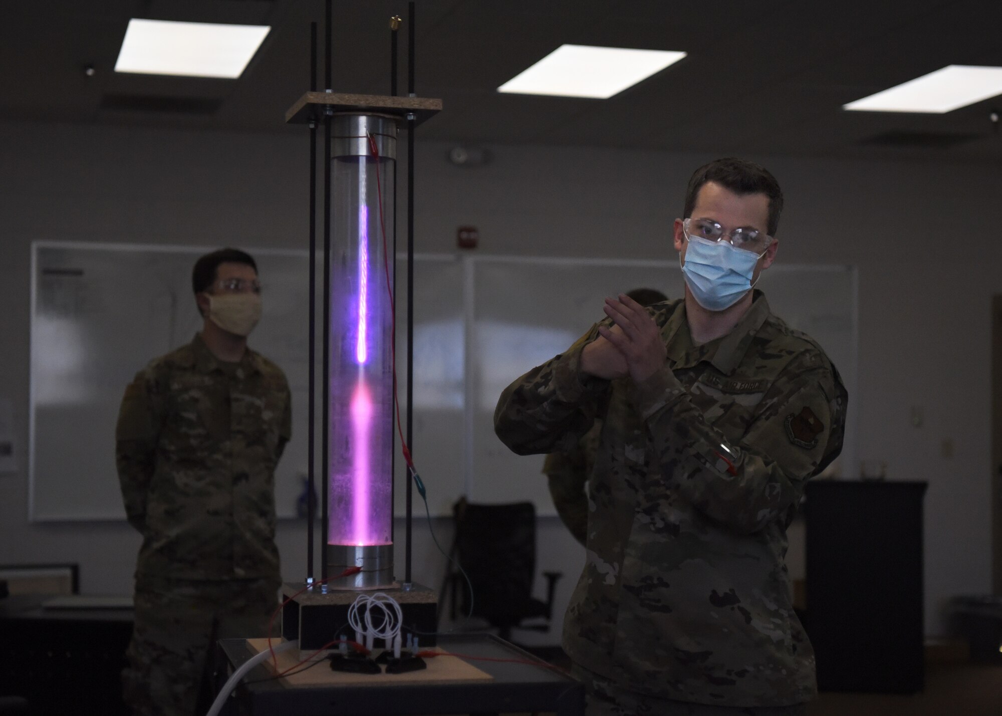 U.S. Air Force Tech. Sgt. David Hunt, 312th Training Squadron Special Instruments Training course instructor, explains different scientific concepts with a student-built plasma chamber, at the Louis F. Garland Department of Defense Fire Academy on Goodfellow Air Force Base, Texas, Aug. 5, 2020. Hunter demonstrated to the SPINSTRA students how volumetric pressure may affect electrons’ flow. (U.S. Air Force photo by Airman 1st Class Abbey Rieves)