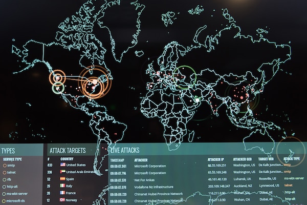 A computer screen shows a map of the globe overlaid with additional information.