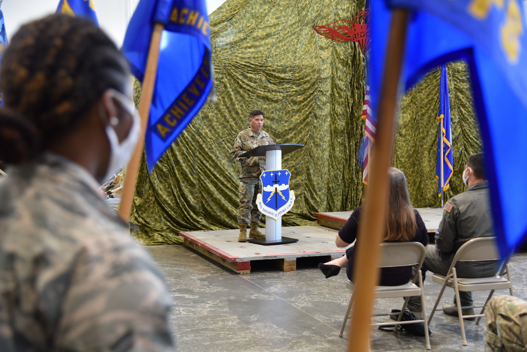 Lt. Col. Reginald G. Trujillo (standing), commander, 403rd Mission Support Group, speaks during the 403rd MSG assumption of command ceremony, August 8, 2020 in the 41st Aerial Port Squadron Building, Keesler Air Force Base, Miss. The 403rd MSG provides security, communication. logistics, personnel management and information management programs for the 403rd Wing’s 1,600 Reserve and civilian personnel. (U.S. Air Force Photo by Tech. Sgt. Michael Farrar)