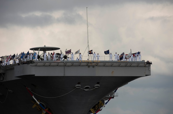 Sailors assigned to USS Dwight D. Eisenhower (CVN 69) man the rails as the ship returns to Naval Station Norfolk.