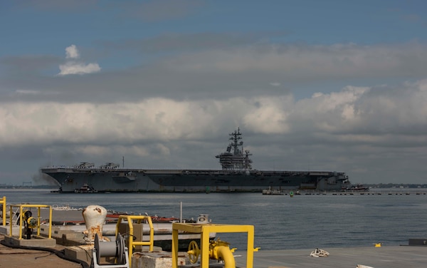 Sailors assigned to USS Dwight D. Eisenhower (CVN 69) man the rails as the ship returns to Naval Station Norfolk.