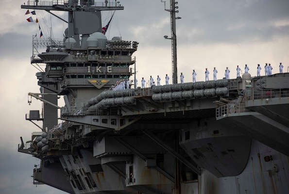 NORFOLK, Va. (Aug. 09, 2020) Sailors assigned to USS Dwight D. Eisenhower (CVN 69) man the rails as the ship returns to Naval Station Norfolk.