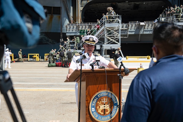 Capt. Kyle Higgins, commanding officer of the Nimitz-class aircraft carrier USS Dwight D. Eisenhower (CVN 69), speaks to the press after a regularly scheduled deployment.