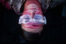 Lance Cpl Jon Marie Roth, an administrative specialist with Combat Logistic Battalion (CLB) 31, 31st Marine Expeditionary Unit (MEU), lays on a stretcher while posing as a combat casualty during a nightingale exercise at Camp Hansen, Okinawa, Japan, July 29, 2020. During a nightingale, Marines and Sailors provide tactical combat casualty care and evacuation of combat casualties. The 31st MEU, the Marine Corps’ only continuously forward-deployed MEU, provides a flexible force ready to perform a wide range of military operations as the premier crisis response force in the Indo-Pacific region. The 31st MEU has implemented strict health protection measures and will continue to conduct mission essential training in support of regional security and stability. (U.S. Marine Corps photo by Sgt. Audrey M.C. Rampton)