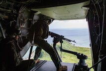 Lance Cpl. Benjamin Carr, a tiltrotor crew chief with Marine Medium Tiltrotor Squadron 262 (Reinforced), 31st Marine Expeditionary Unit, fires an M240 machine gun during a training exercise at a tail gun range off the coast of Okinawa, Japan, July 30, 2020. The training consisted of field carrier landing practice and live firing from an MV-22B Osprey Tiltrotor aircraft. The 31st MEU, the Marine Corps’ only continuously forward-deployed MEU, provides a flexible and lethal force ready to perform a wide range of military operations as the premier crisis response force in the Indo-Pacific region. The 31st MEU has implemented strict health protection measures and will continue to conduct mission essential training in support of regional security and stability. (U.S. Marine Corps photo by Lance Cpl. Brienna Tuck)