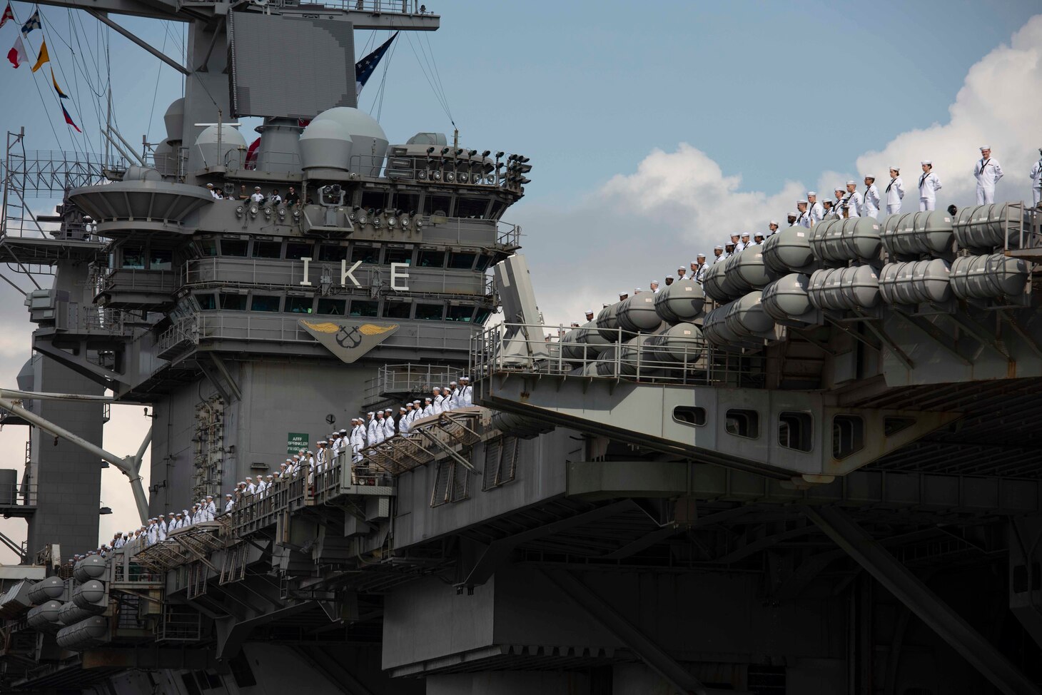 Sailors assigned to USS Dwight D. Eisenhower (CVN 69) man the rails as the ship returns to Naval Station Norfolk.