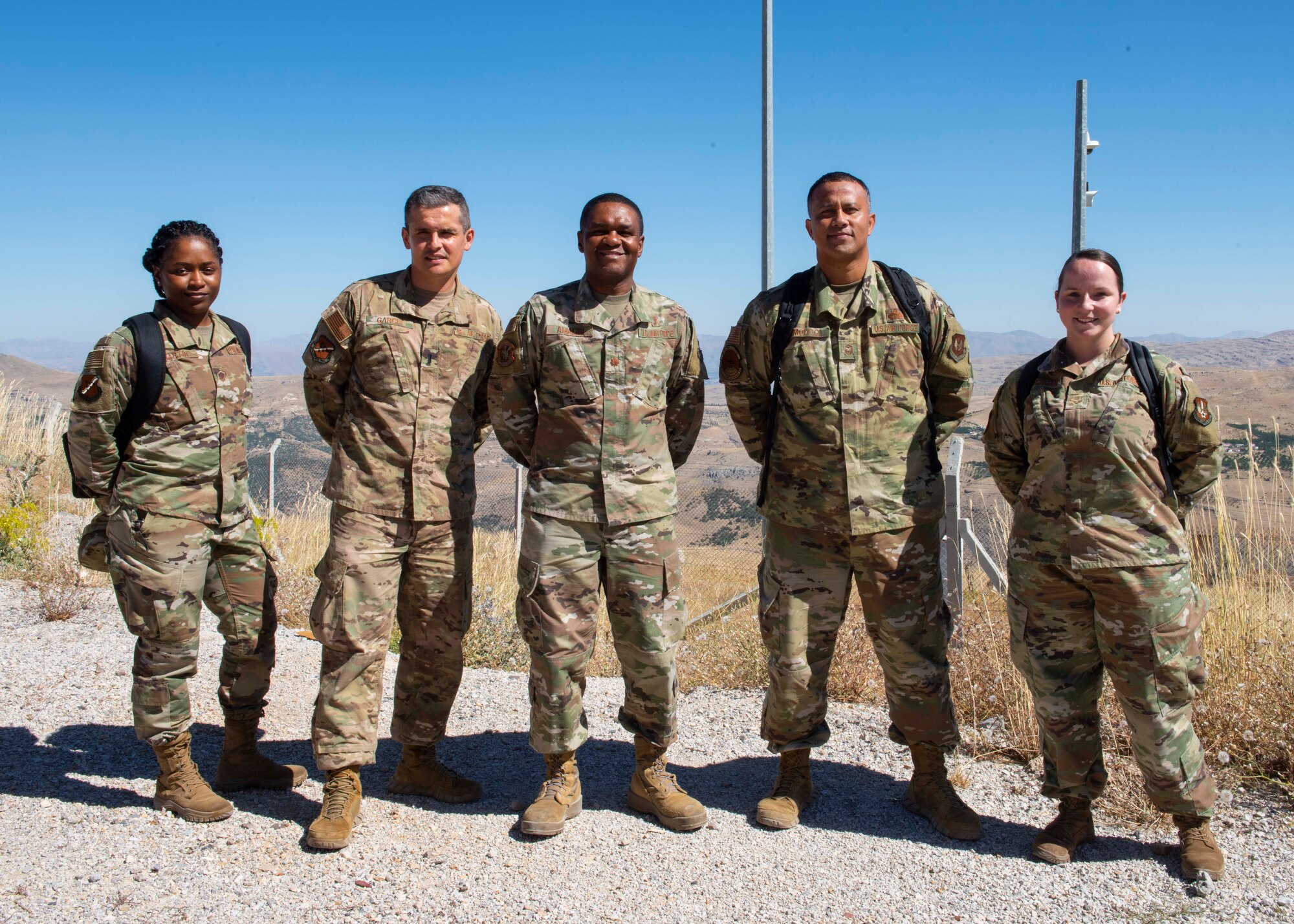 Group of 5 Airmen standing for a photo