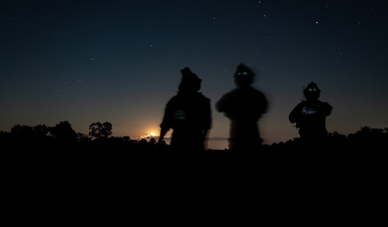 Tactical air control party Airmen assigned to the 113th Air Support Operations Squadron of the 181st Intelligence Wing from the Indiana Air National Guard observe an aircraft during night close air support training at Atterbury Range at the Camp Atterbury Joint Maneuver Training Center, Ind., Aug. 4, 2020. TACPs from the 113th ASOS provide joint terminal attack controller capabilities to air assets to execute military ground commanders’ intent.