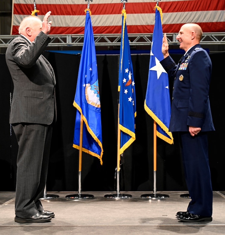 Lt. Gen. Carl Schaefer, Air Force Materiel Command Deputy Commander, swears an oath for the first time as a newly-promoted lieutenant general, Aug. 7 at the National Museum of the United States Air Force, Wright-Patterson Air Force Base, Ohio. (photo by Darrius Parker)
