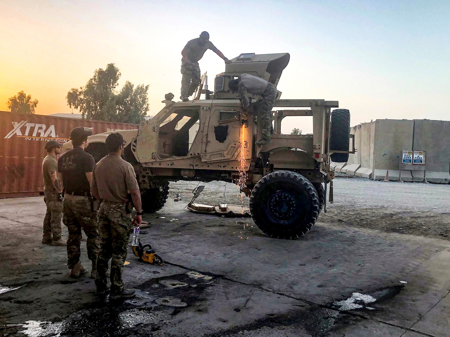 As the sun sets, airmen from the Air Force’s 48th Rescue Squadron get the chance to practice their extrication skills in the dark during a July 31 training session at the DLA Disposition Services yard at Kandahar, Afghanistan.