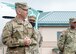 Chief Master Sgt. Sean Sullivan speaks to wing members at his promotion ceremony at Otis Air National Guard Base, Mass.