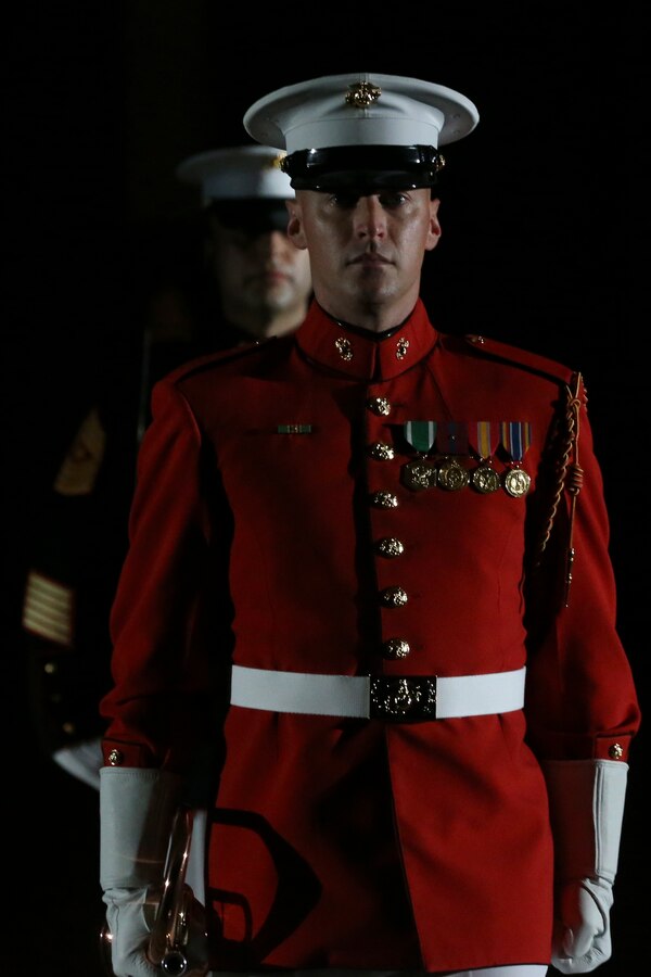 Staff Sgt. Christopher Walker, ceremonial bugler and acting director, “The Commandant’s Own” U.S. Marine Drum and Bugle Corps, marches down “Center Walk” during the Staff Noncommissioned Officer Friday Evening Parade at the Barracks, Aug. 7, 2020. The 19th Sergeant Major of the Marine Corps, Sgt. Maj. Troy E. Black, hosted the ceremony, and Senior Enlisted Advisor to the Chairman of the Joint Chiefs of Staff Ramón “CZ” Colón-López was the guest of honor. Barracks’ SNCOs fulfilled key leader’s billets throughout the ceremony that are normally performed by other Marines from throughout the battalion.