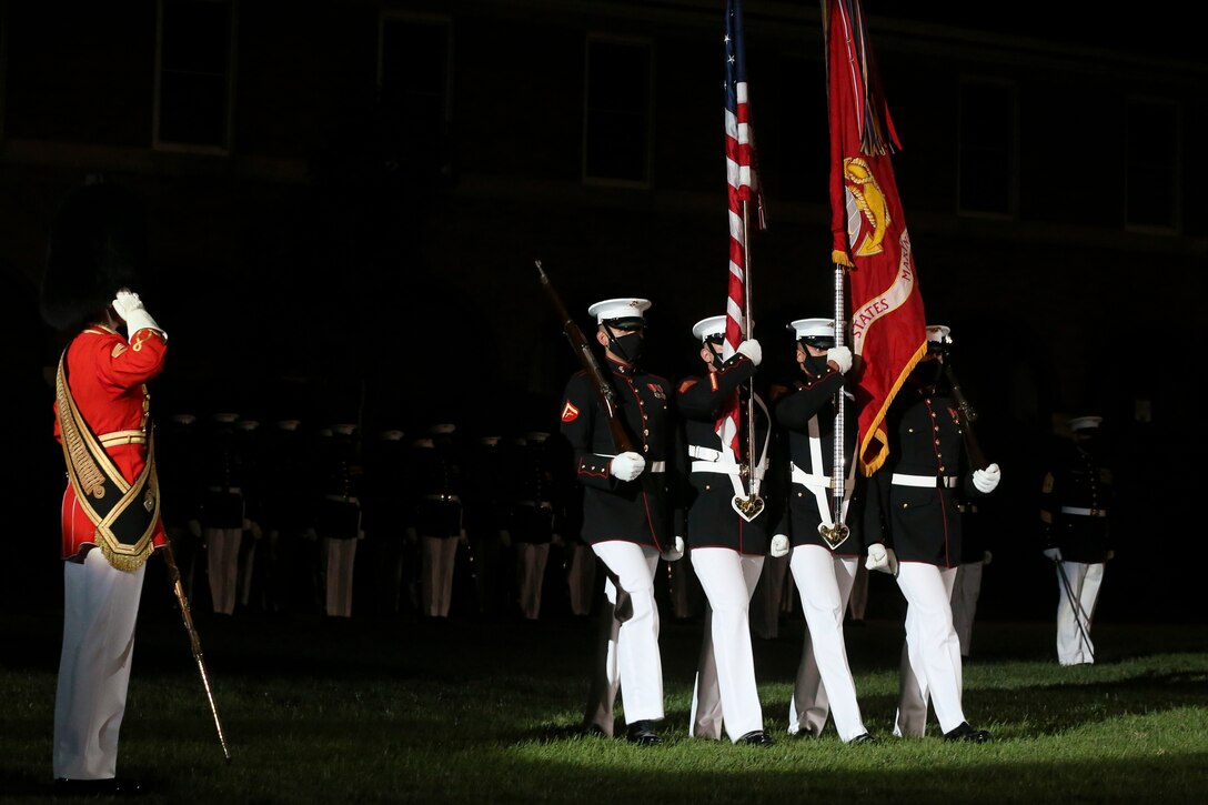 Marines with the official U.S. Marine Corps Color Guard march across the parade deck during the Staff Noncommissioned Officer Friday Evening Parade at the Barracks, Aug. 7, 2020. The 19th Sergeant Major of the Marine Corps, Sgt. Maj. Troy E. Black, hosted the ceremony, and Senior Enlisted Advisor to the Chairman of the Joint Chiefs of Staff Ramón “CZ” Colón-López was the guest of honor. Barracks’ SNCOs fulfilled key leader’s billets throughout the ceremony that are normally performed by other Marines from throughout the battalion.