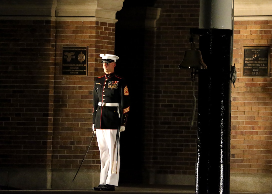 Gunnery Sgt. Brett Nelson, acting company first sergeant, Alpha Company, Marine Barracks Washington, stands at the position of attention during the Staff Noncommissioned Officer Friday Evening Parade at Marine Barracks Washington, D.C., Aug. 7, 2020. Staff Noncommissioned Officers took charge and filled key leaders’ roles and billets throughout the parade. The 19th Sergeant Major of the Marine Corps, Sgt. Maj. Troy E. Black, hosted last night’s ceremony, and the guest of honor was the Senior Enlisted Advisor to the Chairman of the Joint Chiefs of Staff, Ramón “CZ” Colón-López. (U.S. Marine Corps photo by Lance Cpl. Allen Sanders)