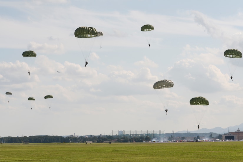Soldiers parachuting from a C-130 Hercules.