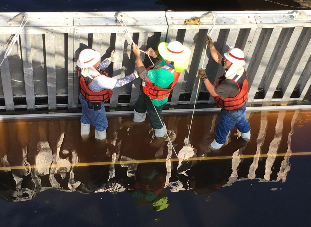 As each needle is added, the crew secures it to the girder.