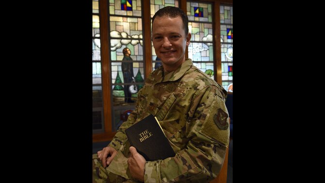 U.S. Air Force Capt. Matthew Thompson, 439th Airlift Wing Chaplain, sits with a bible July 24, 2020, at Westover Air Reserve Base, Massachusetts. Thompson has been a chaplain at Westover since 2017 and is transitioning to active duty in August 2020. (U.S. Air Force photo by Tech. Sgt. Shane M. Phipps)