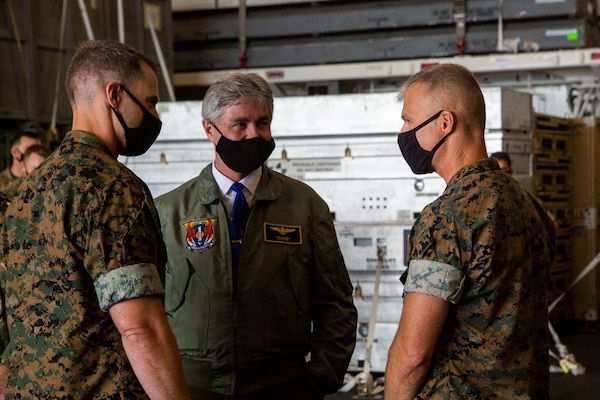 Secretary of the Navy (SECNAV) Kenneth J. Braithwaite speaks with U.S. Marine Corps Col. Christopher Bronzi, commanding officer of the 15th Marine Expeditionary Unit, right, and Maj. Daniel Davis, intelligence officer with the 15th MEU, during his visit to the amphibious assault ship USS Makin Island (LHD 8) in the eastern Pacific.