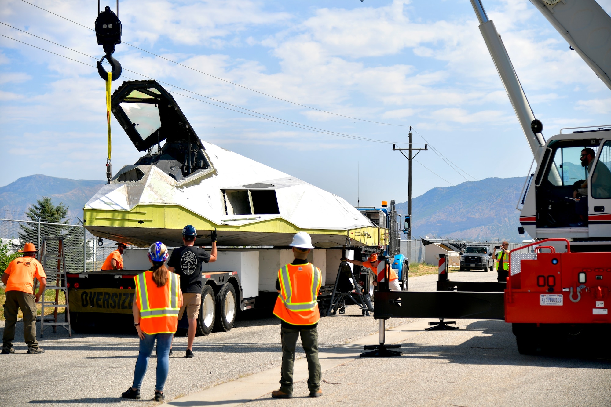 Tonopah Test Range and Hill personnel unload a Lockheed F-117A Aug. 5, 2020, at the Hill Aerospace Museum at Hill Air Force Base, Utah. Tail number 799 was the first operational airframe of a small fleet of 64 stealth aircraft produced and participated in 54 combat sorties in Desert Storm, Allied Force, and Iraqi Freedom. (U.S. Air Force photo by Todd Cromar)
