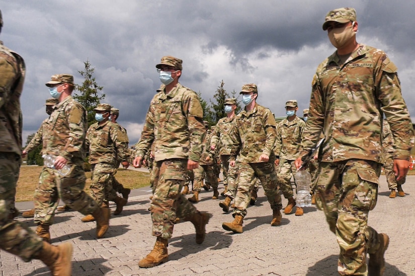 Soldiers march in formation.