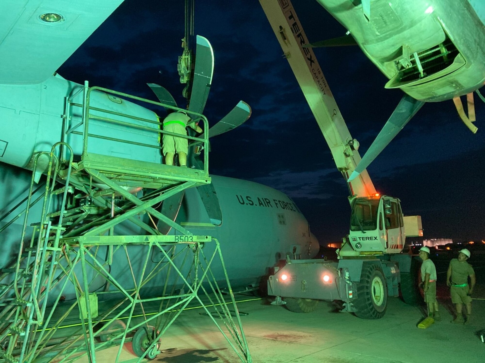 A group of maintainers fix a propeller