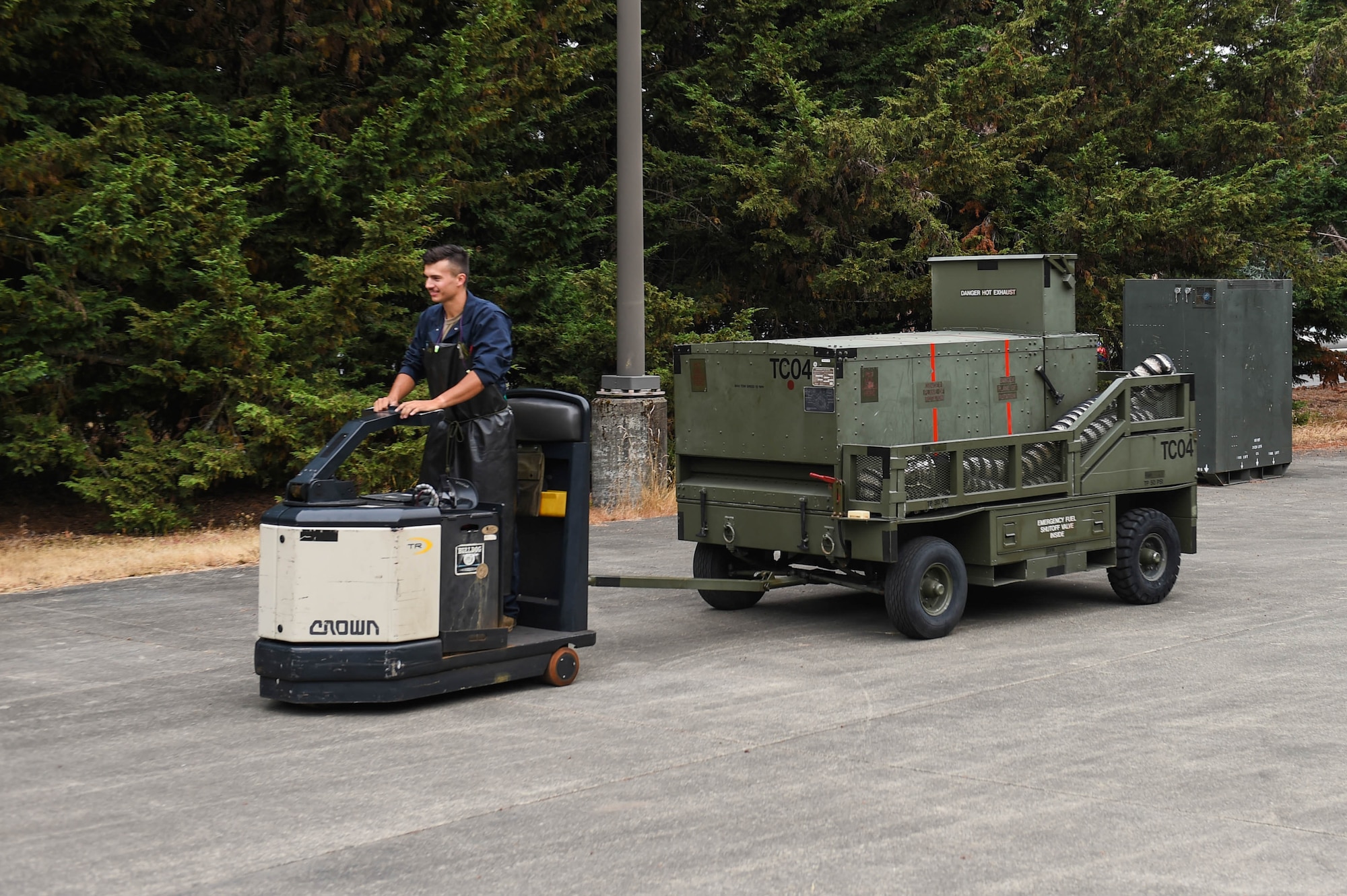 Senior Airman Patrick Christoffersen, 62nd Maintenance Squadron aerospace ground equipment (AGE) journeyman, tows a generator from the AGE storage lot to prepare it for cargo loading onto a C-17 Globemaster III on Joint Base Lewis-McChord, Wash., Aug 3, 2020. The AGE flight within the 62nd MXS provides and maintains various units of equipment that are used on the flight line such as generators, air conditioning units, heaters, and more. (U.S. Air Force photo by Airman 1st Class Mikayla Heineck)