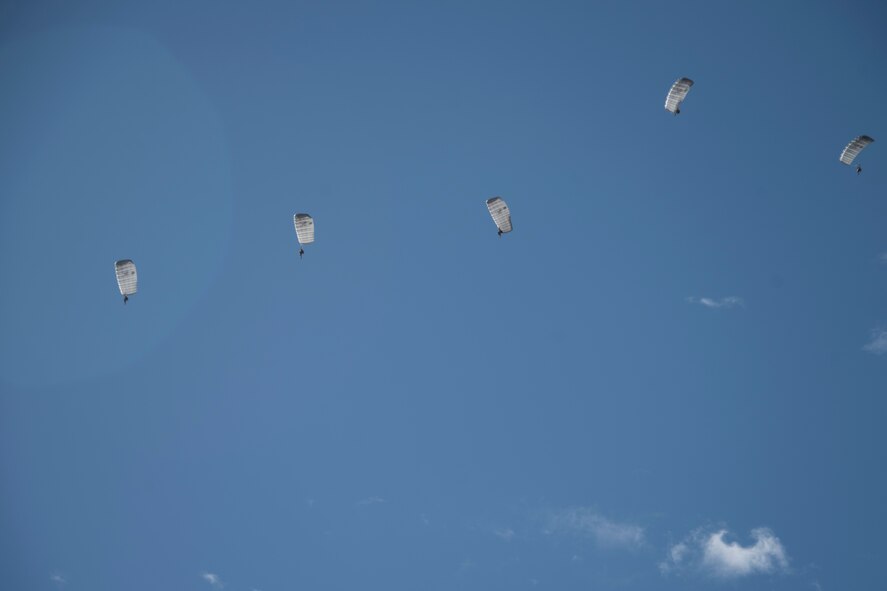 A photo of an Airman performing a parachute jump