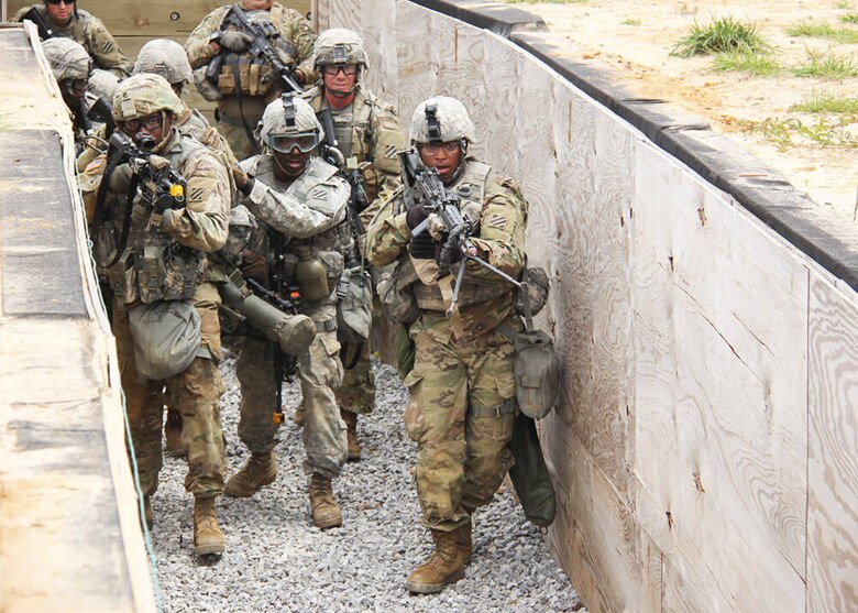 Soldiers of the 48th Infantry Brigade Combat Team approach a target during a live-fire drill as part of the unit’s 2018 rotation at the Joint Readiness Training Center at Fort Polk, La. The U.S. Army Engineering and Support Center, Huntsville is the designated Range and Training Land Program Mandatory Center of Expertise.