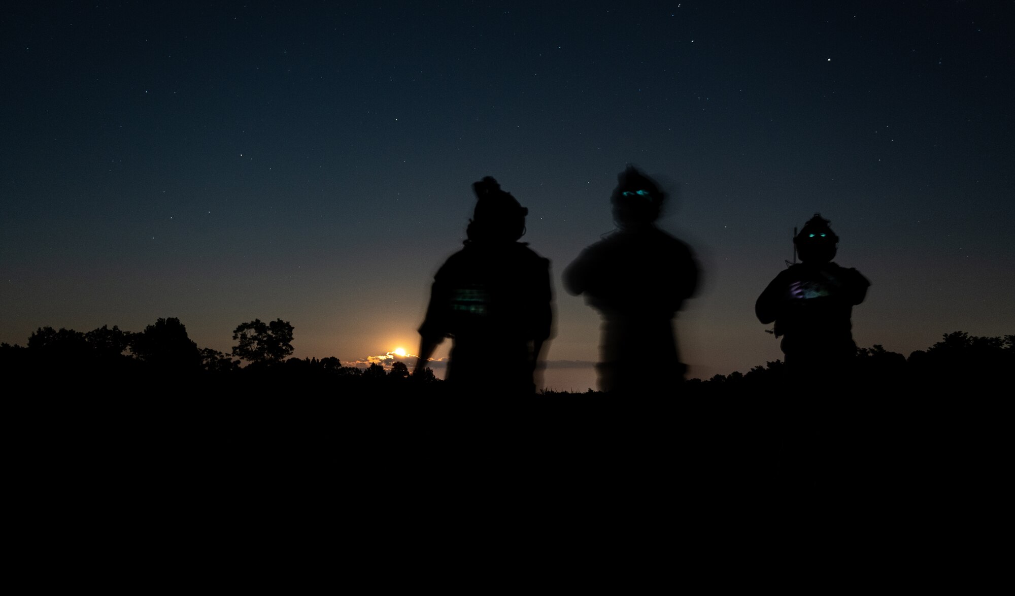 Tactical air control party Airmen assigned to the 113th Air Support Operations Squadron of the 181st Intelligence Wing from the Indiana Air National Guard observe an aircraft during night close air support training at Atterbury Range at the Camp Atterbury Joint Maneuver Training Center, Ind., Aug. 4, 2020. TACPs from the 113th ASOS provide joint terminal attack controller capabilities to air assets to execute military ground commanders’ intent.