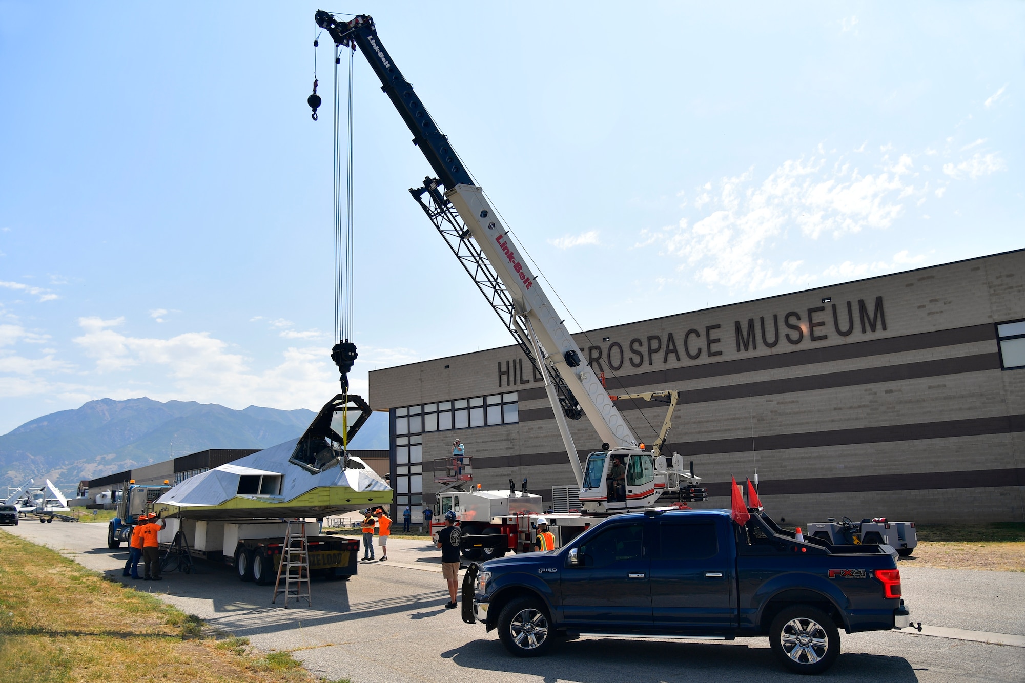 Tonopah Test Range and Hill personnel unload a Lockheed F-117A Aug. 5, 2020, at the Hill Aerospace Museum at Hill Air Force Base, Utah. Tail number 799 was the first operational airframe of a small fleet of 64 stealth aircraft produced and participated in 54 combat sorties in Desert Storm, Allied Force, and Iraqi Freedom. (U.S. Air Force photo by Todd Cromar)