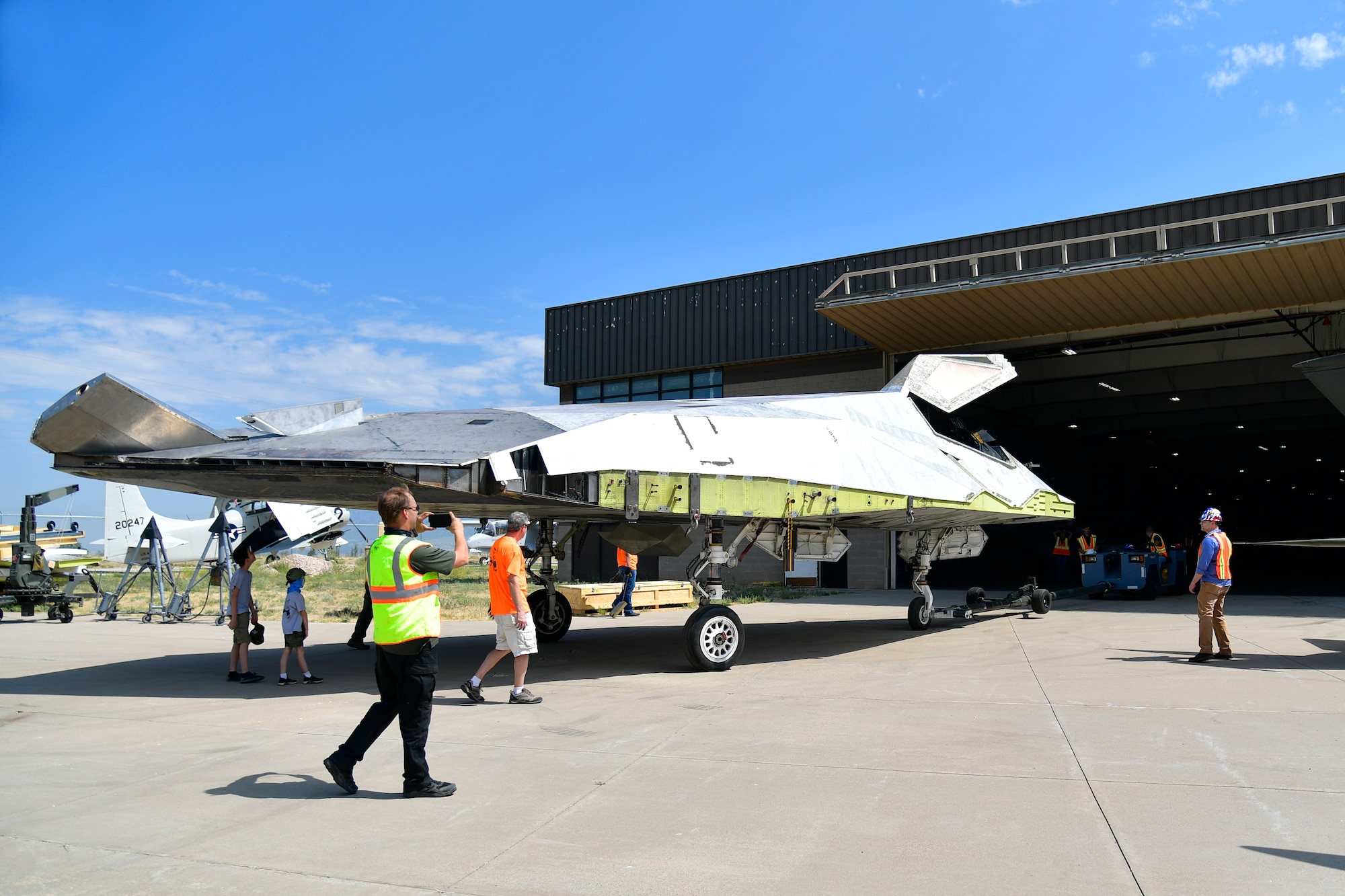Hill Aerospace Museum personnel position a Lockheed F-117A Aug. 5, 2020, at Hill Air Force Base, Utah. Tail number 799 was the first operational airframe of a small fleet of 64 stealth aircraft produced and participated in 54 combat sorties in Desert Storm, Allied Force, and Iraqi Freedom. (U.S. Air Force photo by Todd Cromar)