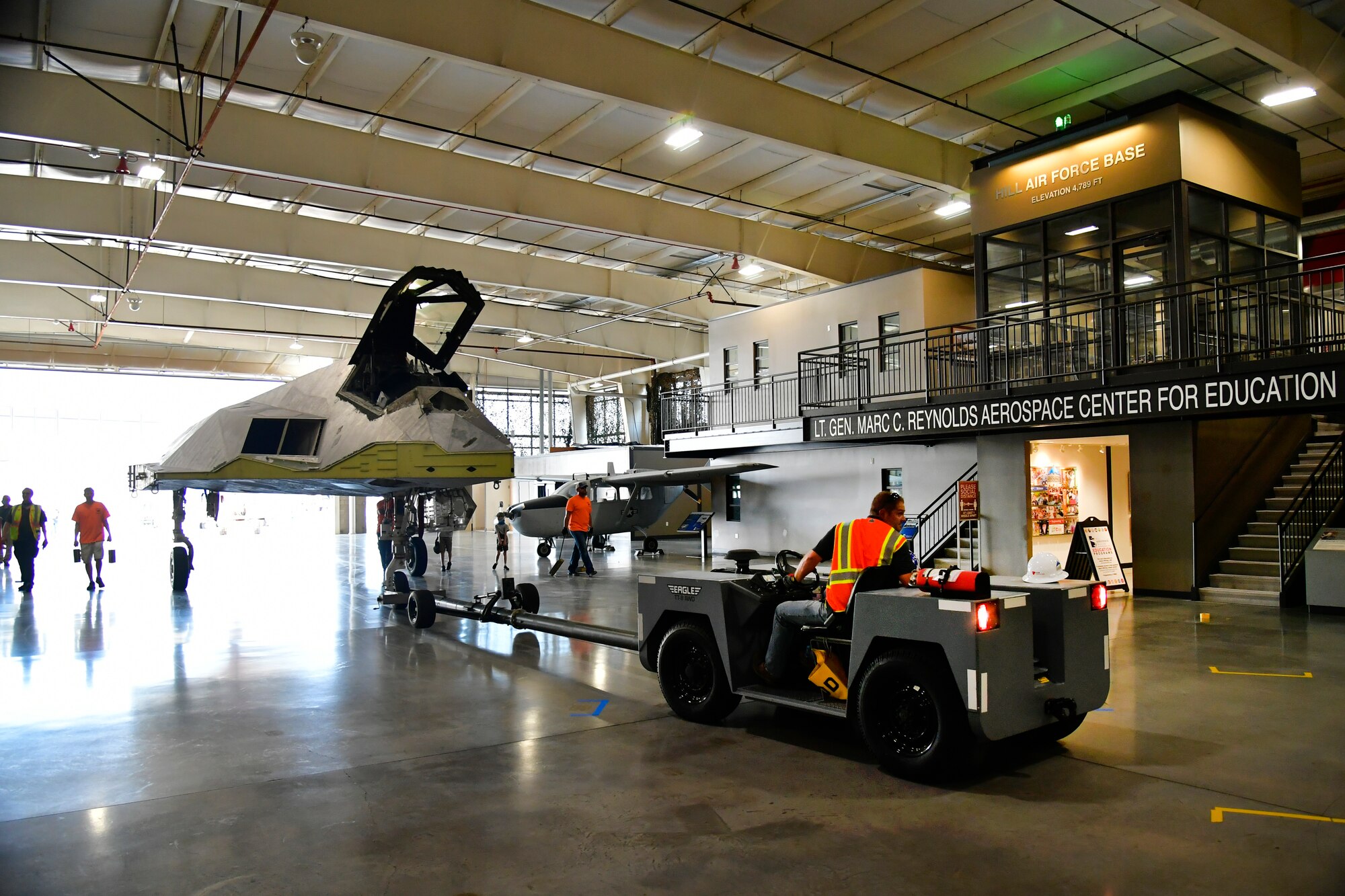 Hill Aerospace Museum personnel position a Lockheed F-117A Aug. 5, 2020, at Hill Air Force Base, Utah. Tail number 799 was the first operational airframe of a small fleet of 64 stealth aircraft produced and participated in 54 combat sorties in Desert Storm, Allied Force, and Iraqi Freedom. (U.S. Air Force photo by Todd Cromar)