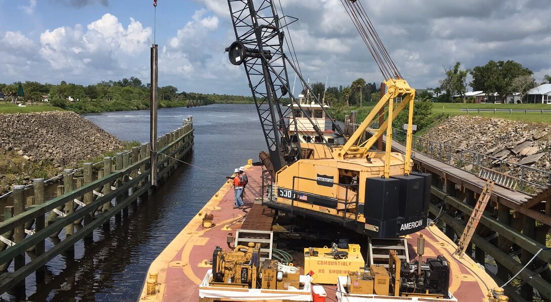 The tag line man helps keep the final seal facing in the right direction is moved into place.