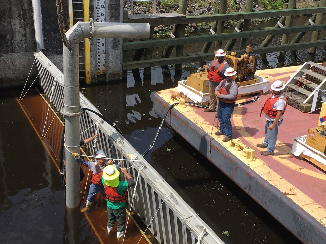 A pump is installed and secured, so water can be pumped out of the lock chamber, providing a relatively dry area for equipment, inspections and repairs.