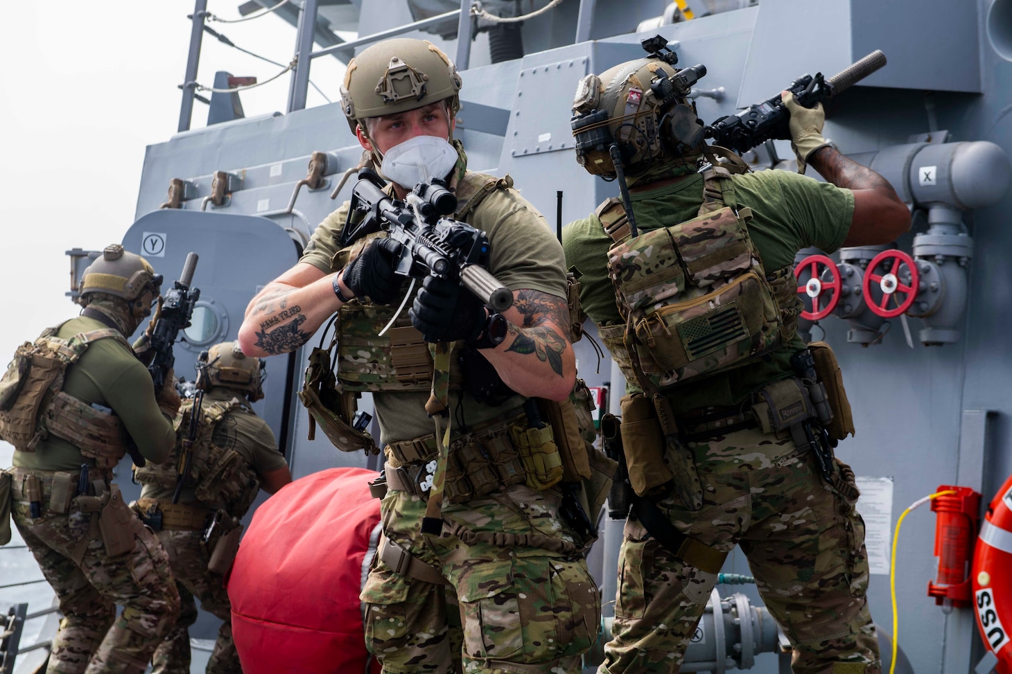 U.S. Coast Guard personnel conducts a close-quarters combat exterior-movement drill aboard Arleigh Burke-class guided-missile destroyer USS Thomas Hudner (DDG 116).