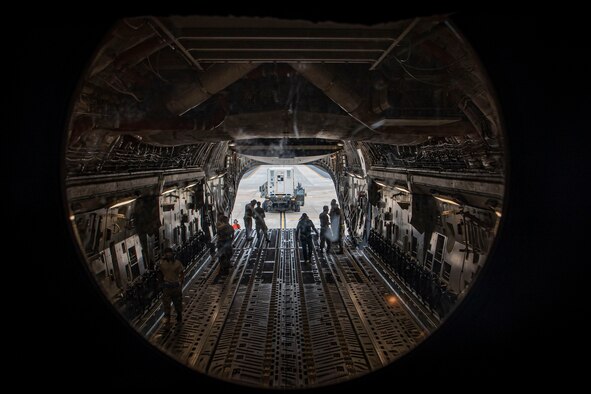 The 305th Air Mobility Wing plays a role in the fight against COVID-19 by delivering the latest isolated containment chamber developed for high-capacity transport of patients.