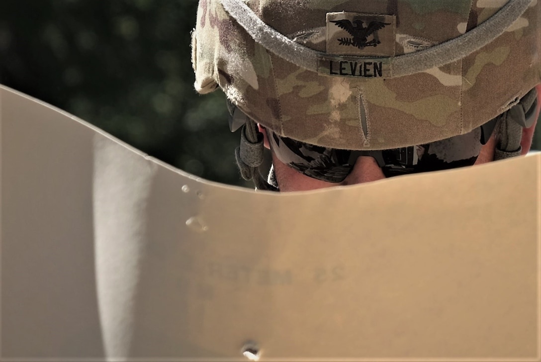 Commander of the 7th Mission Support Command and deputy commander of the 21st Theater Support Command, Col. Douglas A. LeVien, checks his target during a M17 pistol range qualification conducted by the 773rd Civil Support Team, 7th Civil Support Command, during exercise Forward and Ready 20 at United States Army Garrison Bavaria in Grafenwoehr, Aug. 1, 2020.