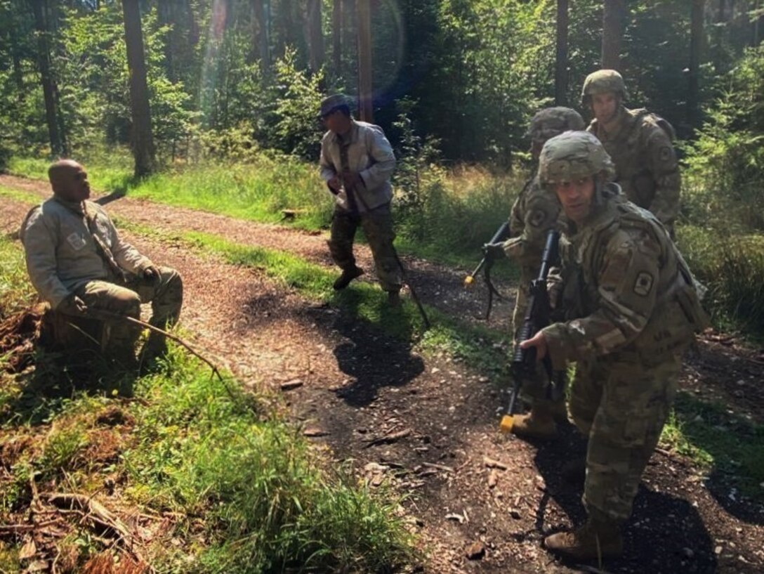 U.S. Army Reserve Soldiers from the 361st Civil Affairs Brigade, 7th Mission Support Command, conduct a tactical training patrol involving reaction to enemy and civilian contact during exercise Forward and Ready 20 at United States Army Garrison Bavaria in Grafenwoehr, Aug. 5, 2020. (U.S. Army Reserve photo by Staff Sgt. Angela Morrow, 361st CA Bde, 7th MSC)