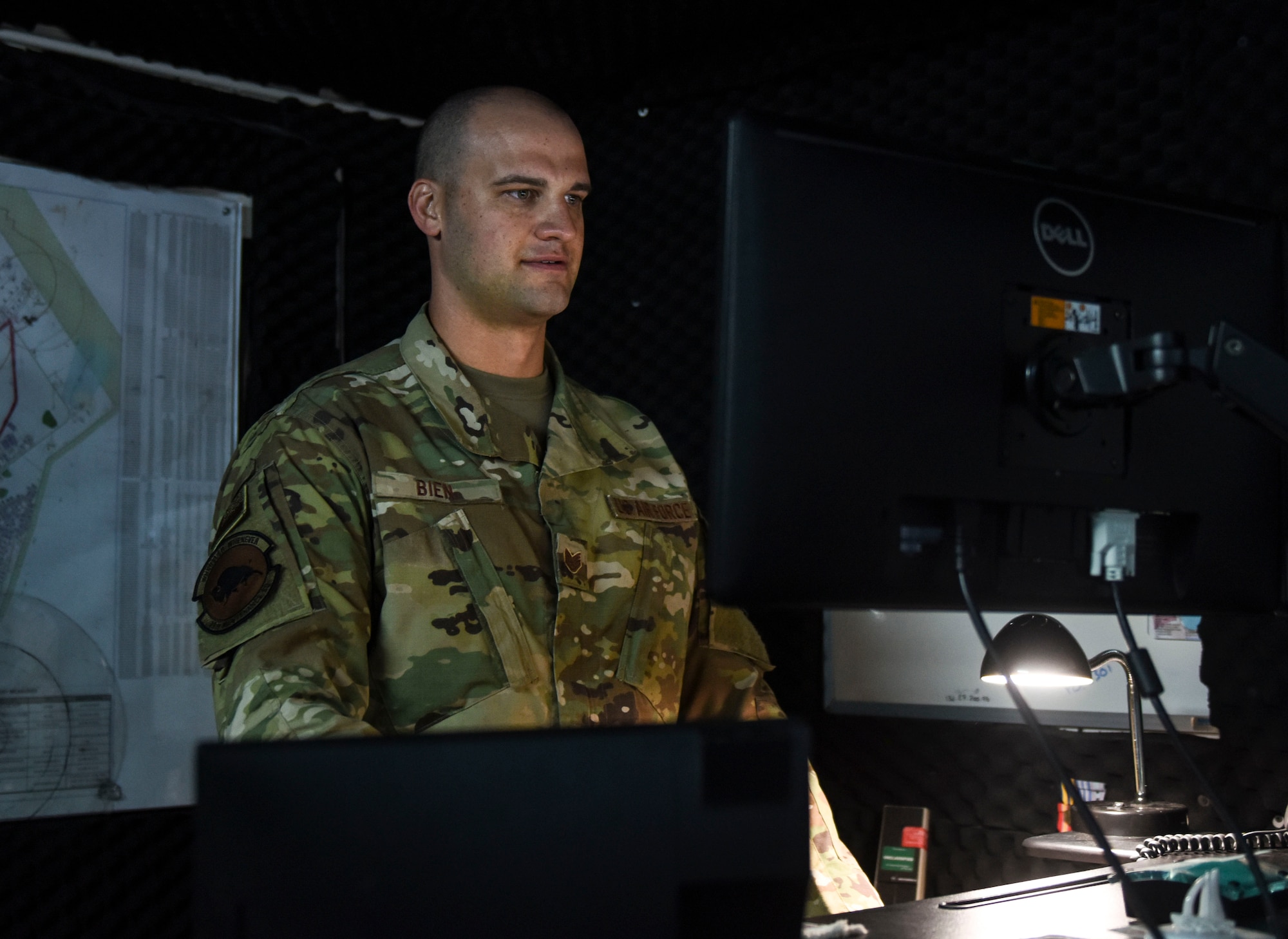 Airman staring at computer screen