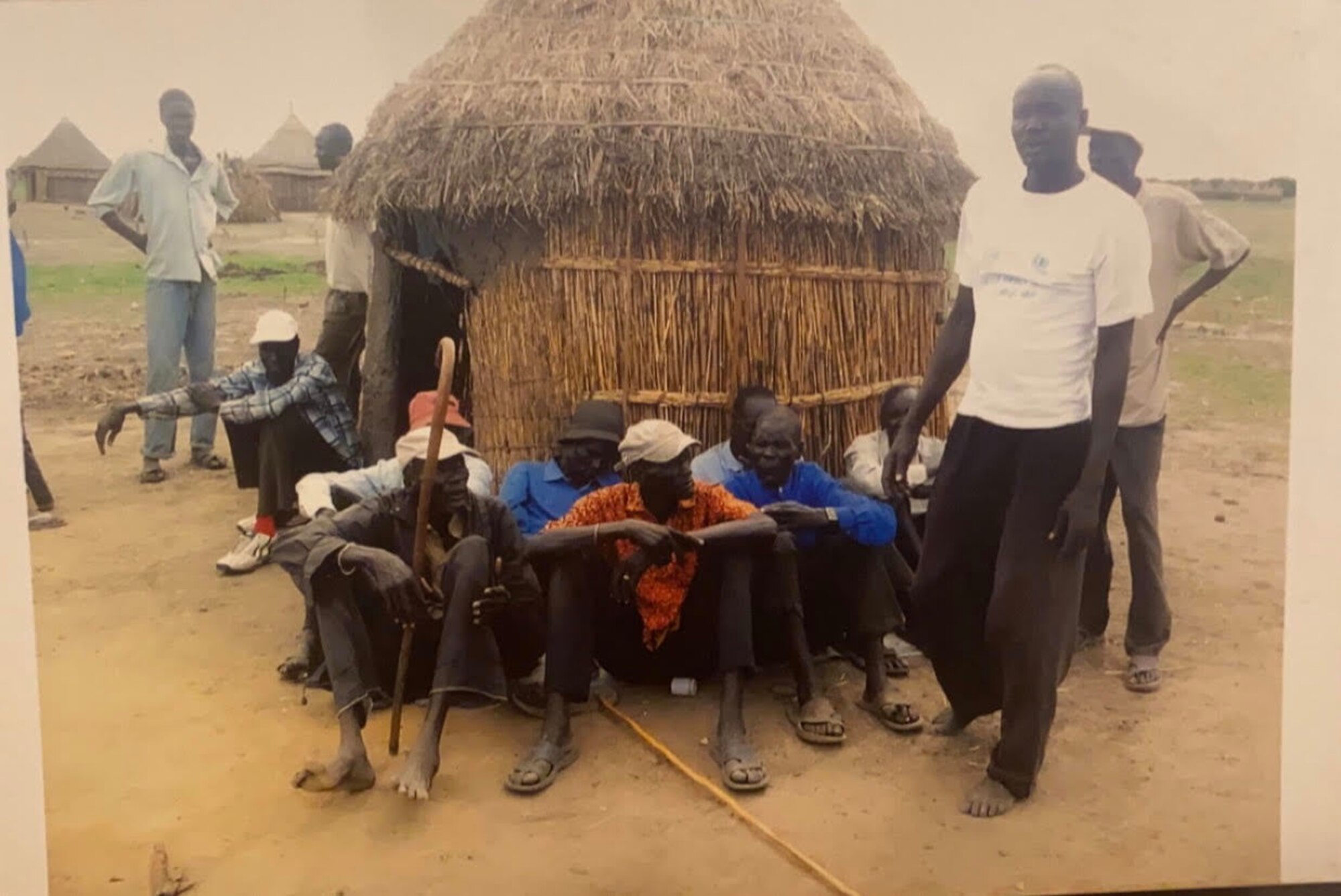 The family of Airman 1st Class Nyarauch Chuol, passenger operations representative with the 32nd Aerial Port Squadron, poses for a photo outside of their home in Gambela, Ethiopia, 2011.