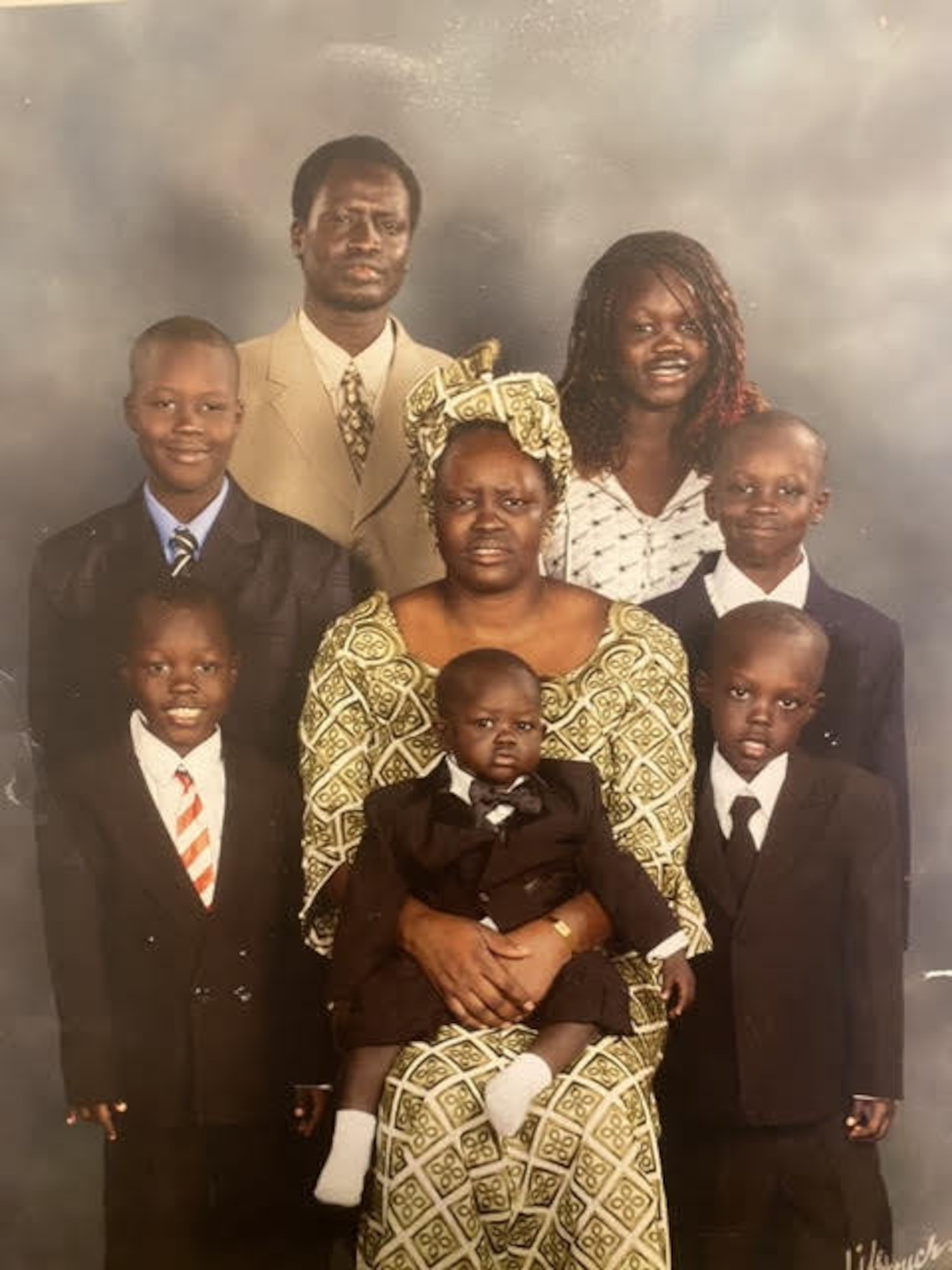 Airman 1st Class Nyarauch Chuol, passenger operations representative with the 32nd Aerial Port Squadron, and her family pose for a photo in Coon Rapids, Minnesota, on an unknown date.