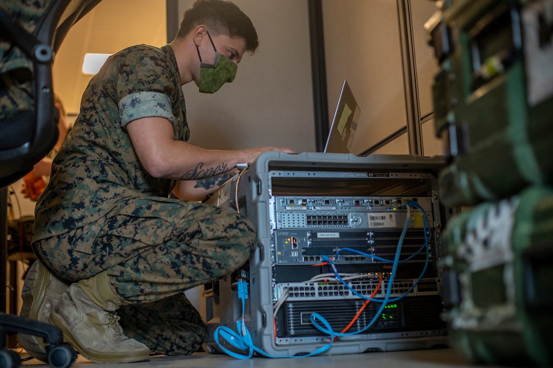 Cpl. Elijah Soper, a network administrator with Special Purpose Marine Air-Ground Task Force - Southern Command, conducts a gear check at Soto Cano Air Base, Honduras, Aug. 5, 2020. A group of approximately 20 Marines from the SPMAGTF-SC has joined with Joint Task Force - Bravo in support of operations and exercises in the Latin American and Caribbean region. The remainder of the task force is prepared to deploy to the region to work alongside partner nation militaries, enhancing combined crisis response efforts in the U.S. Southern Command area of responsibility. Soper is a native of Yelm, Washington. (U.S. Marine Corps photo by Sgt. Andy O. Martinez)