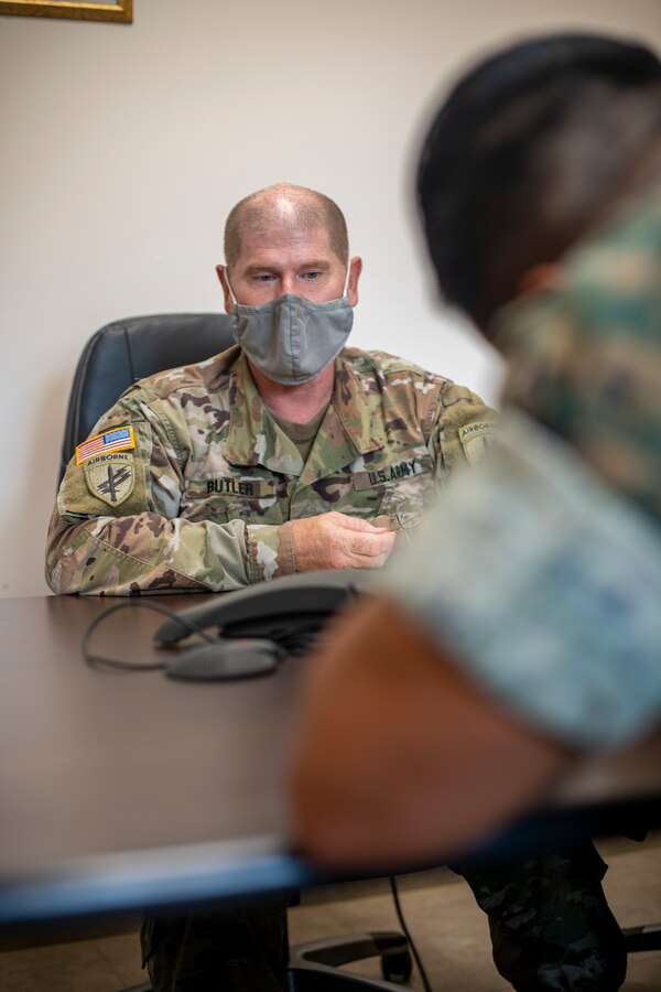 U.S. Army Maj. Derek Butler, a civil liaison officer with Joint Task Force – Bravo, briefs a U.S. Marine Corps civil affairs specialist with Special Purpose Marine Air-Ground Task Force - Southern Command on a civil affairs mission at Soto Cano Air Base, Honduras, Aug. 6, 2020. A group of approximately 20 Marines from the SPMAGTF-SC has joined with Joint Task Force - Bravo in support of operations and exercises in the Latin American and Caribbean region. The remainder of the task force is prepared to deploy to the region to work alongside partner nation militaries, enhancing combined crisis response efforts in the U.S. Southern Command area of responsibility. Butler is a native of Houston, Texas. (U.S. Marine Corps photo by Sgt. Andy O. Martinez)