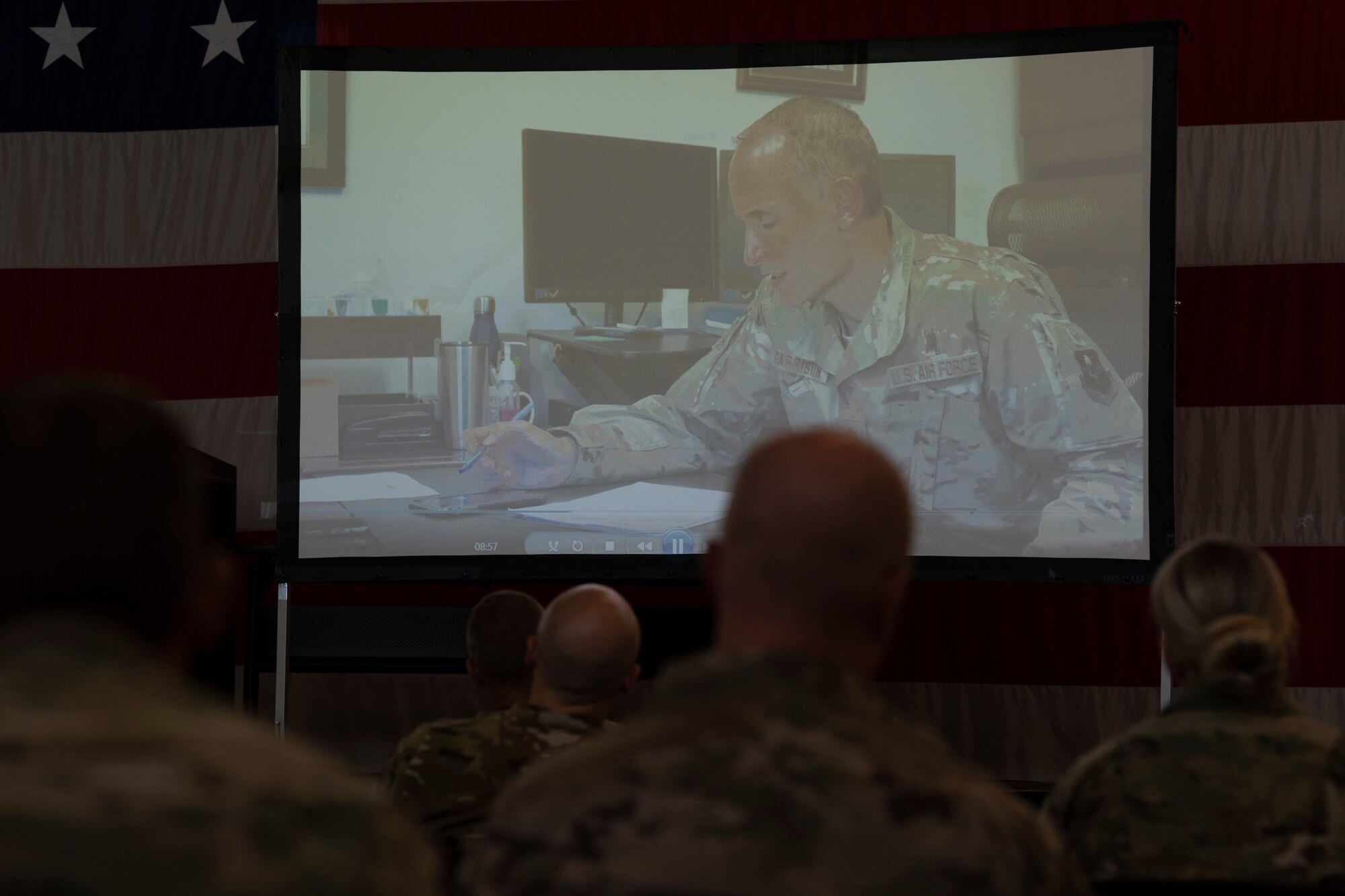 Photo of Airmen watching a video