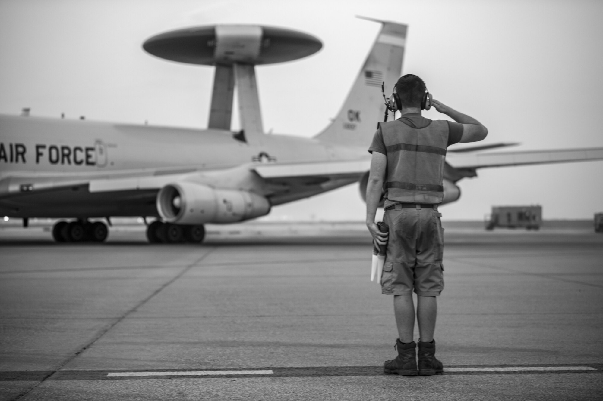 An Airman with the 380th Expeditionary Aircraft Maintenance Squadron E-3 Sentry Aircraft Maintenance Unit flags the 968th Expeditionary Airborne Air Control Squadron’s E-3 Sentry (AWACS) here July 18, 2020.