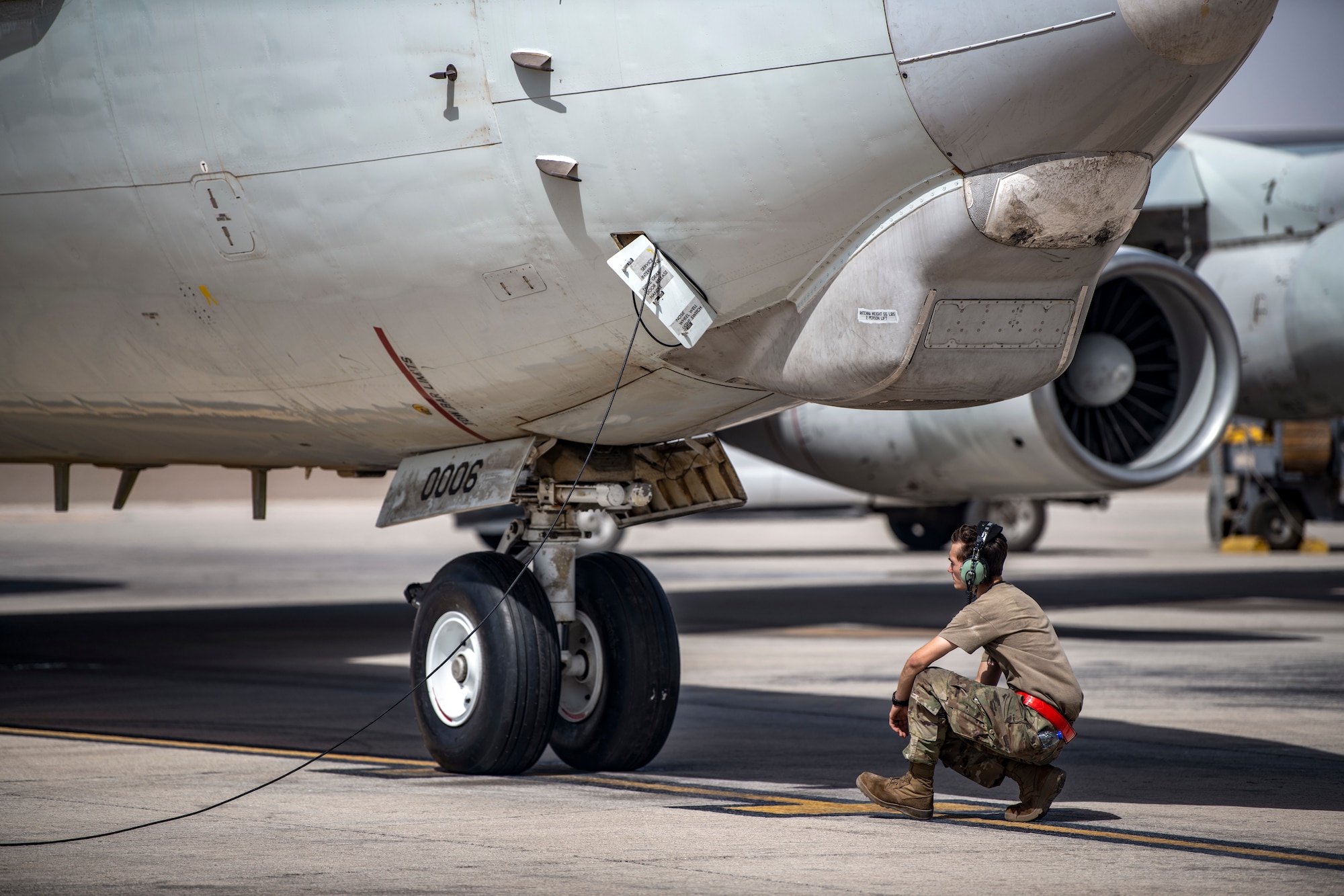 Airman 1st Class Cameron Hollingshead, 380th Expeditionary Aircraft Maintenance Squadron E-3 Sentry Aircraft Maintenance Unit, prepare an E-3 Sentry for flight here July 28, 2020.