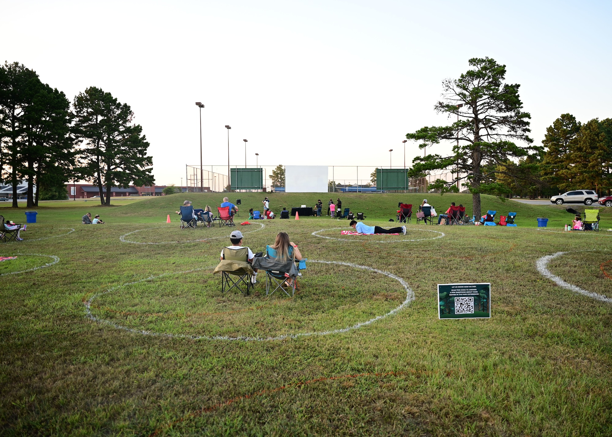 People watch a movie in the base park